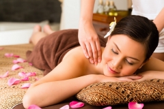 Chinese Asian woman in wellness beauty spa having aroma therapy massage with essential oil, looking